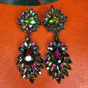 Green iridescent statement earrings.